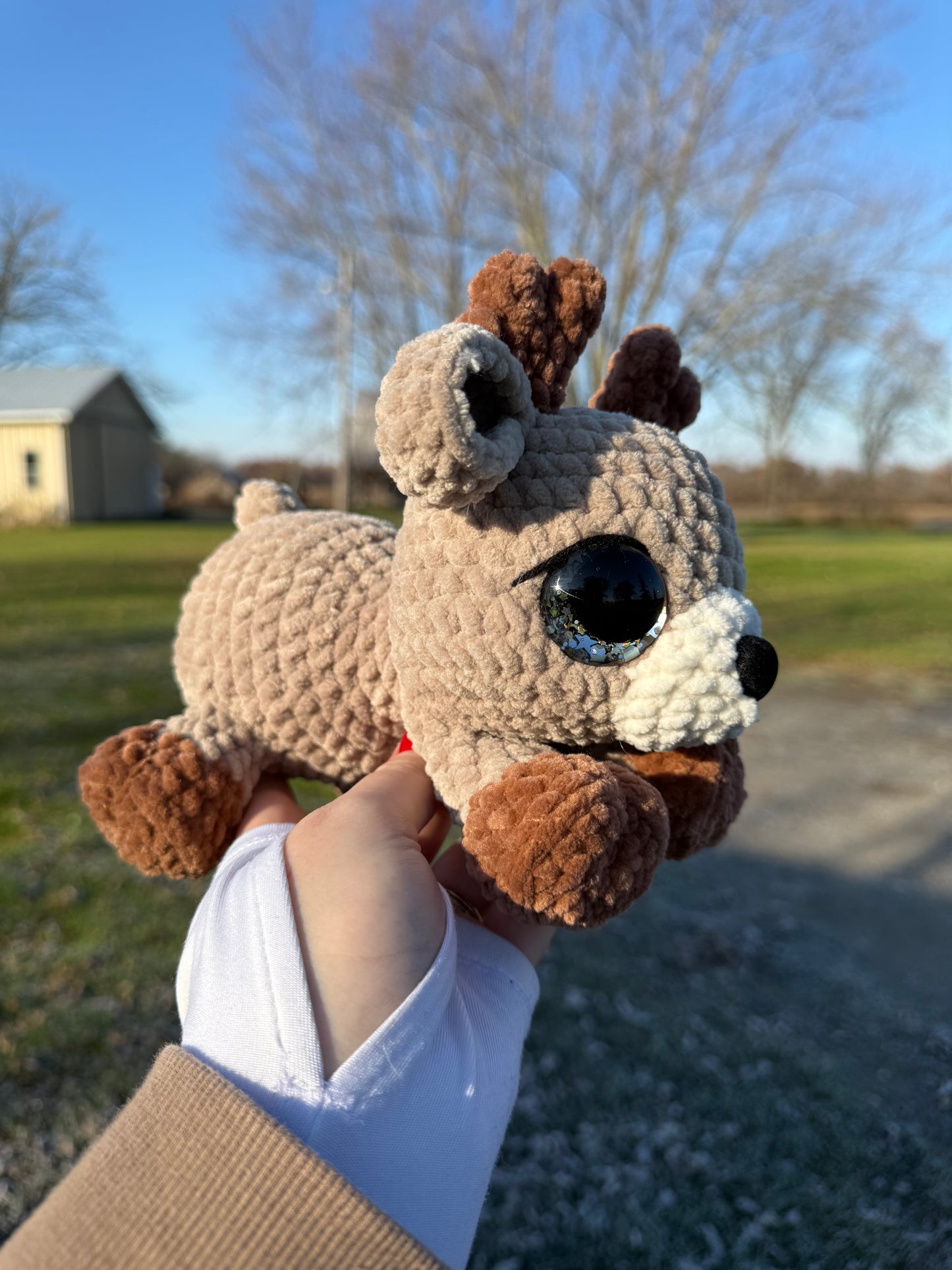 Laying reindeer plush